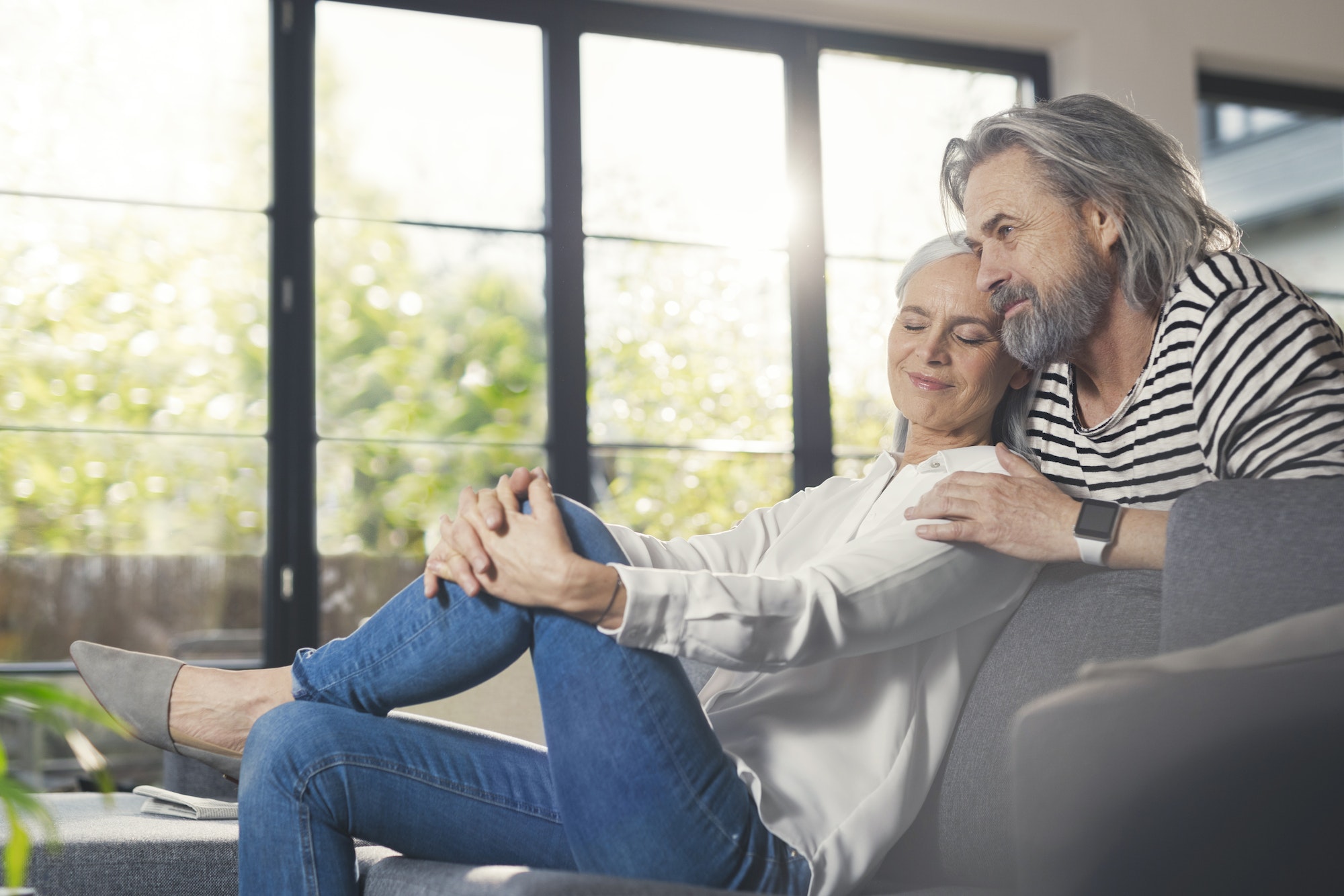 Happy senior couple sitting at home